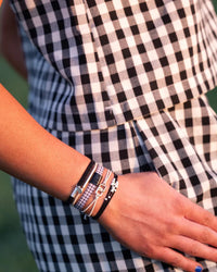 Bracelets élastiques à cheveux noirs et argentés « Unité » (medium)